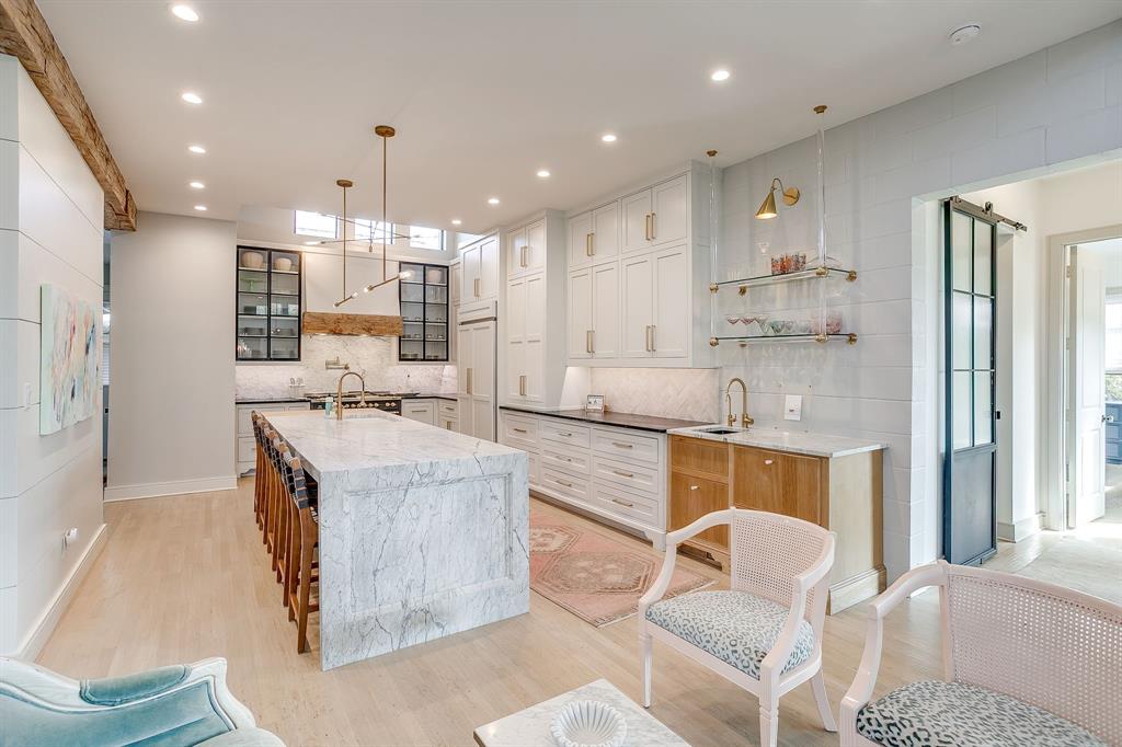 357 Wood Lake Road Aledo, TX 76008 - Photo 17 of 40 a kitchen with kitchen island stainless steel appliances a sink and a refrigerator