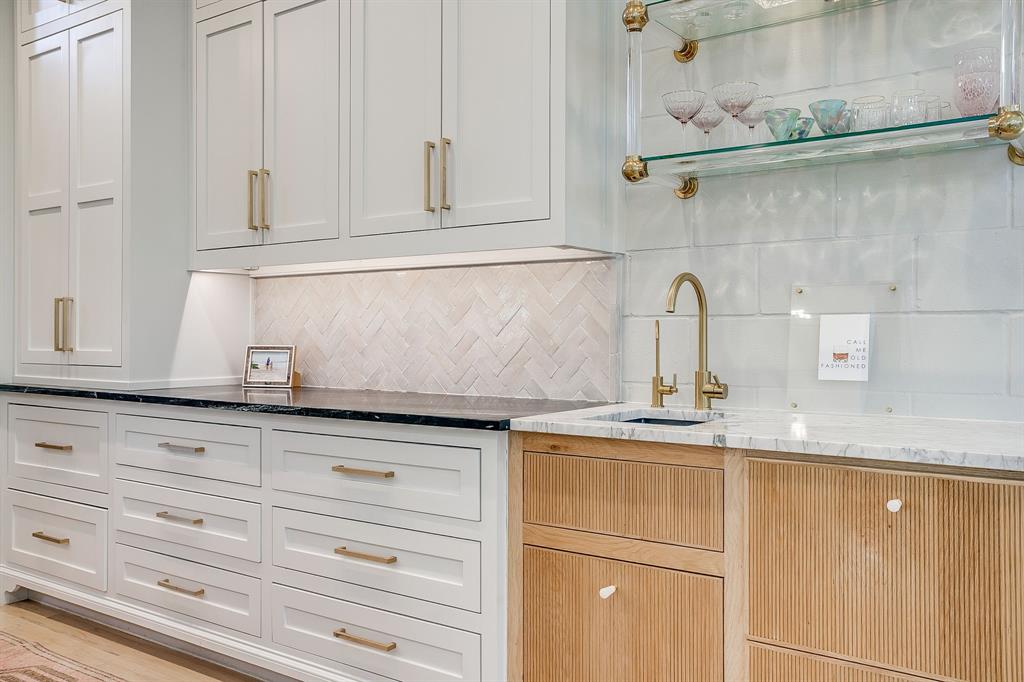 357 Wood Lake Road Aledo, TX 76008 - Photo 19 of 40 a kitchen with granite countertop white cabinets and white appliances