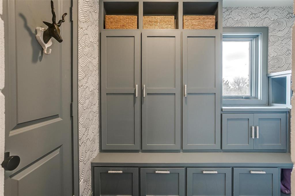 357 Wood Lake Road Aledo, TX 76008 - Photo 20 of 40 a view of cabinets and a wooden door