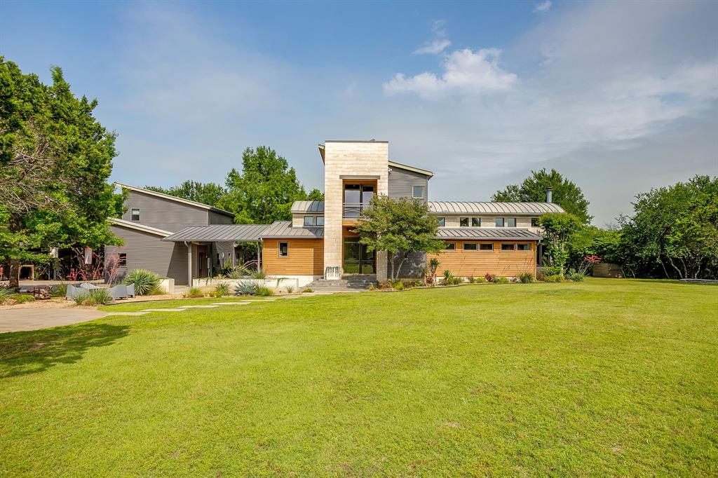 357 Wood Lake Road Aledo, TX 76008 - Photo 3 of 40 a front view of a house with a garden and trees