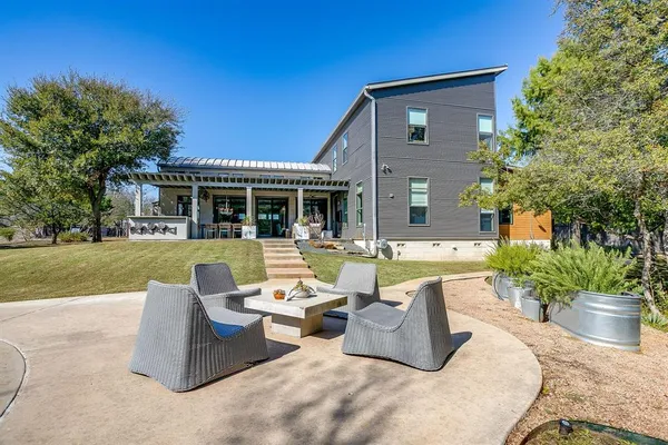 a view of a chairs and table in the patio