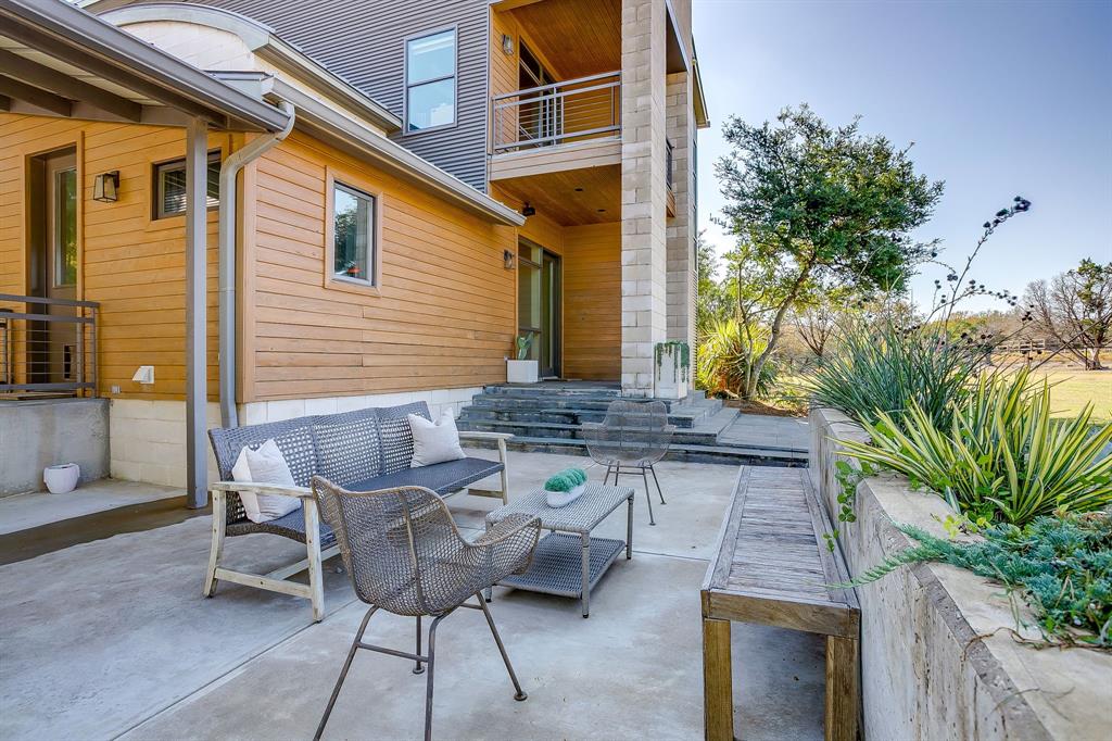 357 Wood Lake Road Aledo, TX 76008 - Photo 33 of 40 a view of a chairs and table in the patio