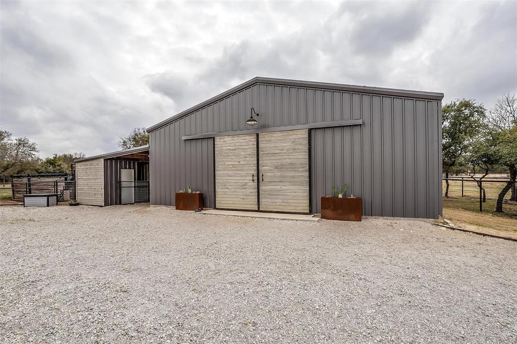 357 Wood Lake Road Aledo, TX 76008 - Photo 36 of 40 a view of a house with a garage