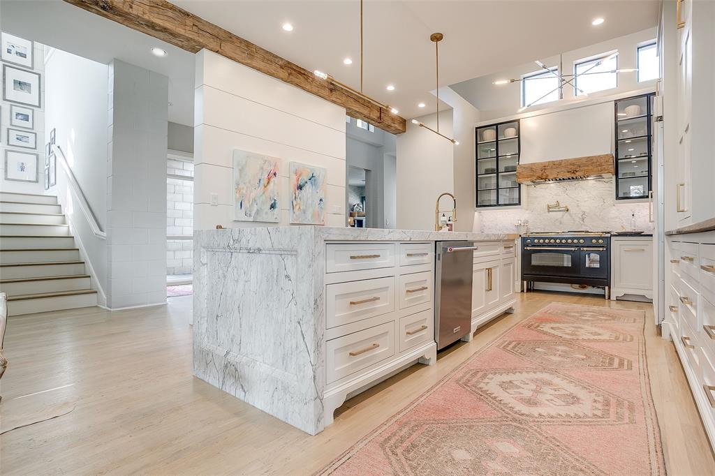 357 Wood Lake Road Aledo, TX 76008 - Photo 4 of 40 a kitchen with stainless steel appliances kitchen island granite countertop a stove a sink and a refrigerator
