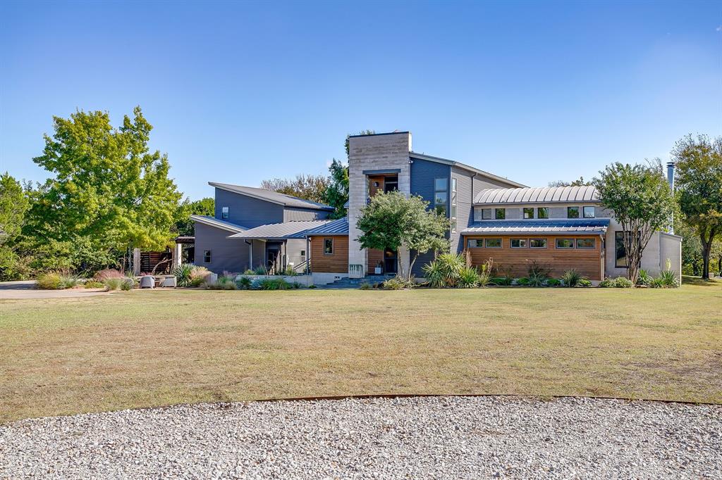 357 Wood Lake Road Aledo, TX 76008 - Photo 5 of 40 a front view of a house with a yard and trees