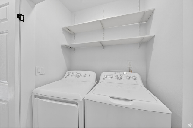 6969 South 855 East Midvale, UT 84047 - Photo 14 of 55 Laundry area featuring a washer and dryer set