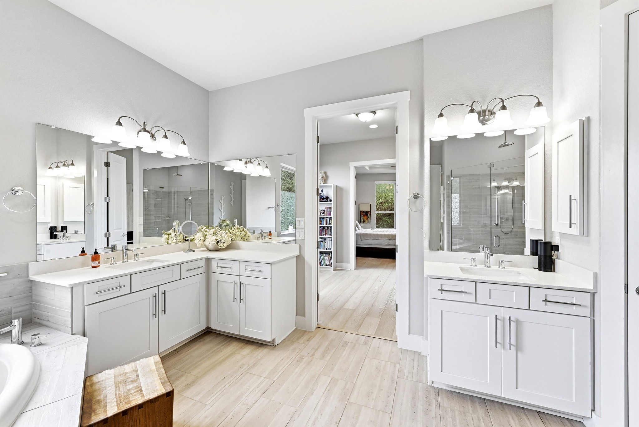 9008 Harper Rae Drive Austin, TX 78717 - Photo 21 of 39 Spacious bathroom featuring two separate vanity areas with white cabinetry and quartz countertops