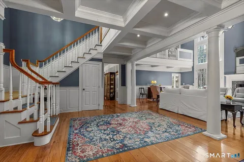 a view of living room and wooden floor