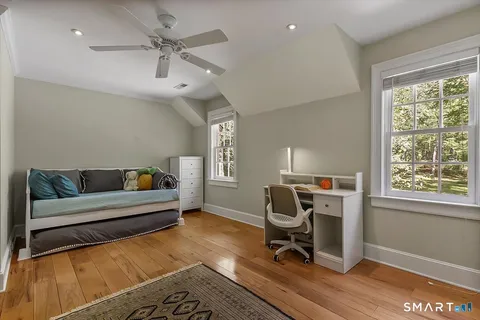 a work room with furniture and wooden floor