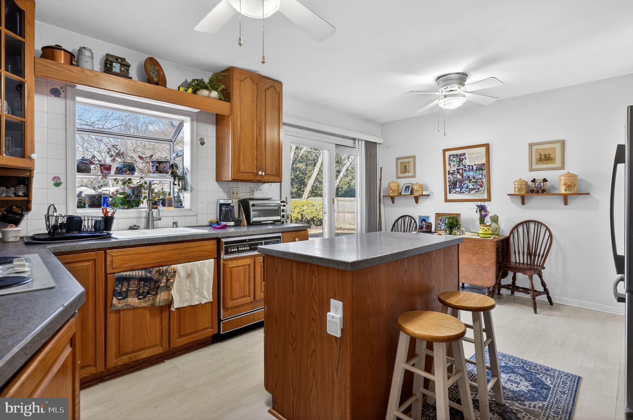1725 Tarrytown Avenue Crofton, MD 21114 - Photo 13 of 39 a dining table with chairs and cabinets