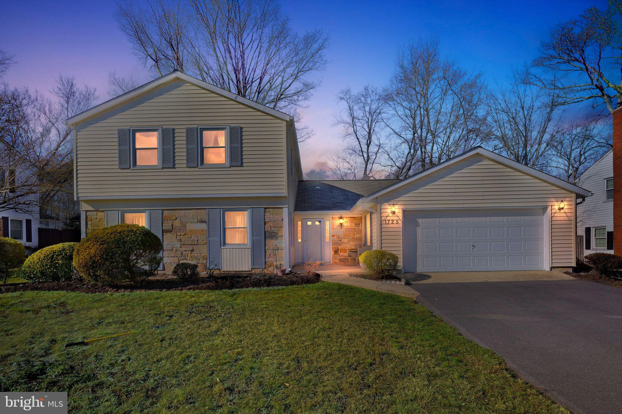 1725 Tarrytown Avenue Crofton, MD 21114 - Photo 2 of 39 a front view of a house with a yard and garage