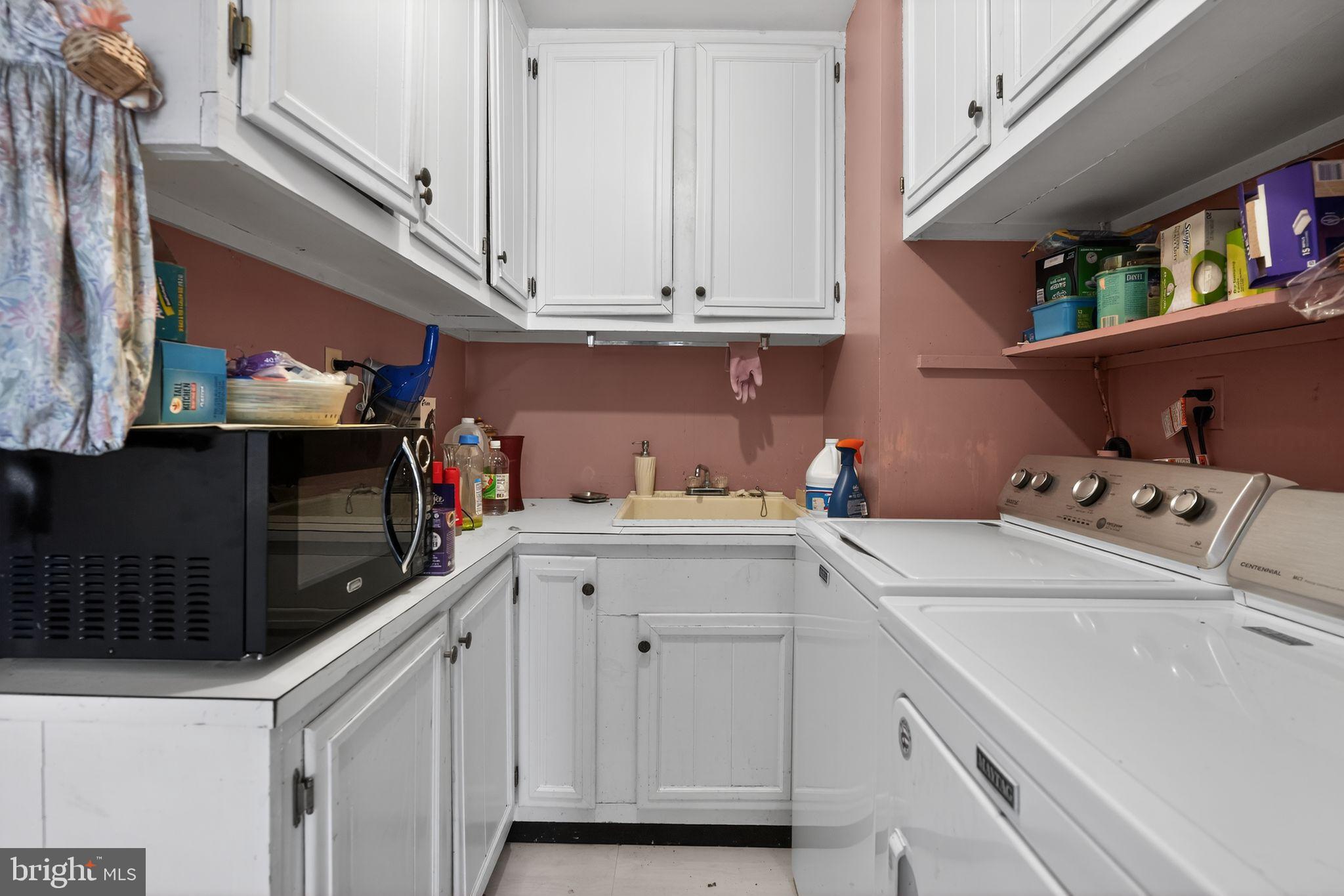 1725 Tarrytown Avenue Crofton, MD 21114 - Photo 23 of 39 a utility room with dryer and washer