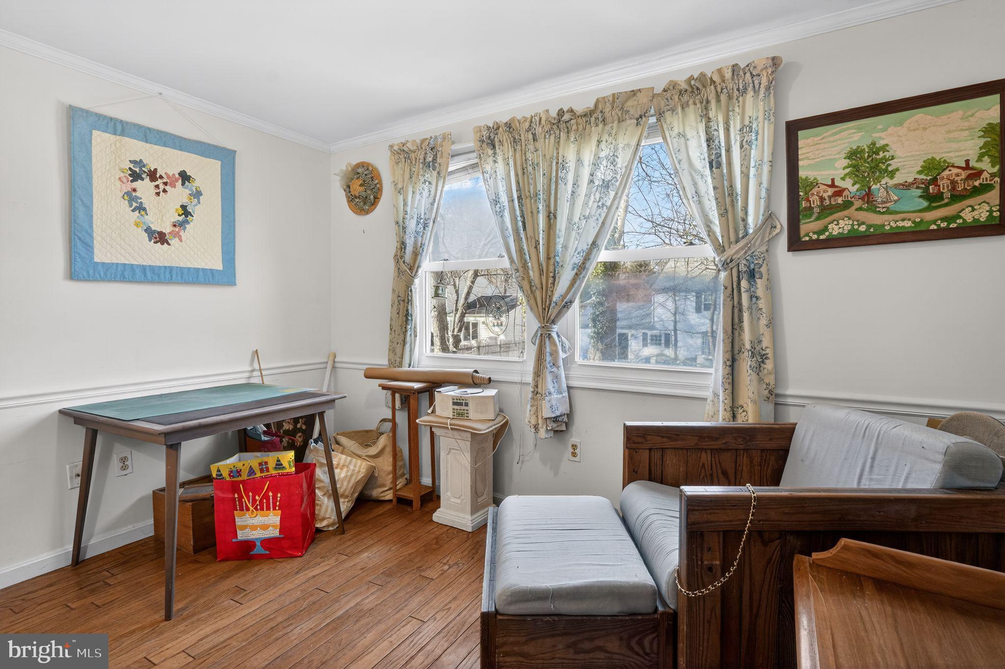 1725 Tarrytown Avenue Crofton, MD 21114 - Photo 28 of 39 a living room with furniture and a wooden floor