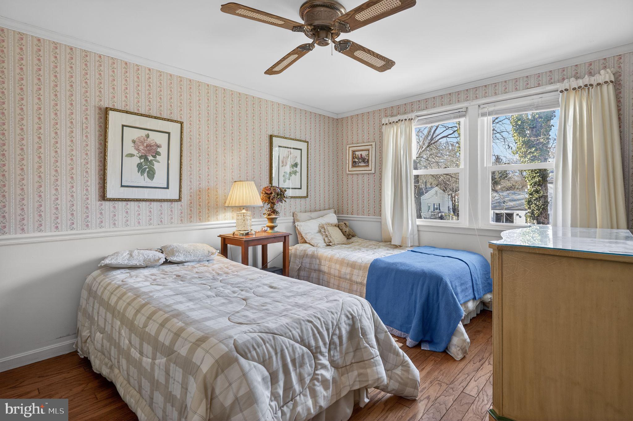 1725 Tarrytown Avenue Crofton, MD 21114 - Photo 29 of 39 a bedroom with two beds and a window