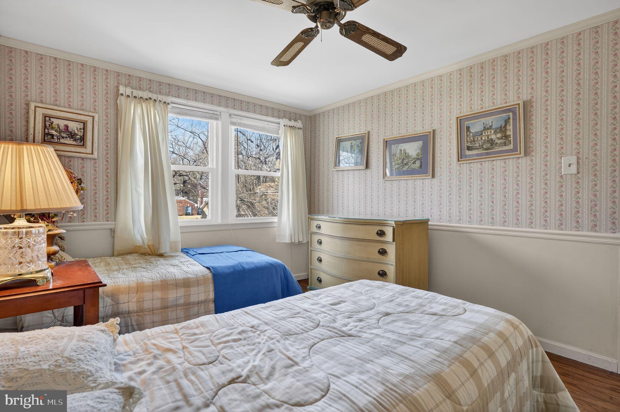 1725 Tarrytown Avenue Crofton, MD 21114 - Photo 30 of 39 a bedroom with two beds and a window