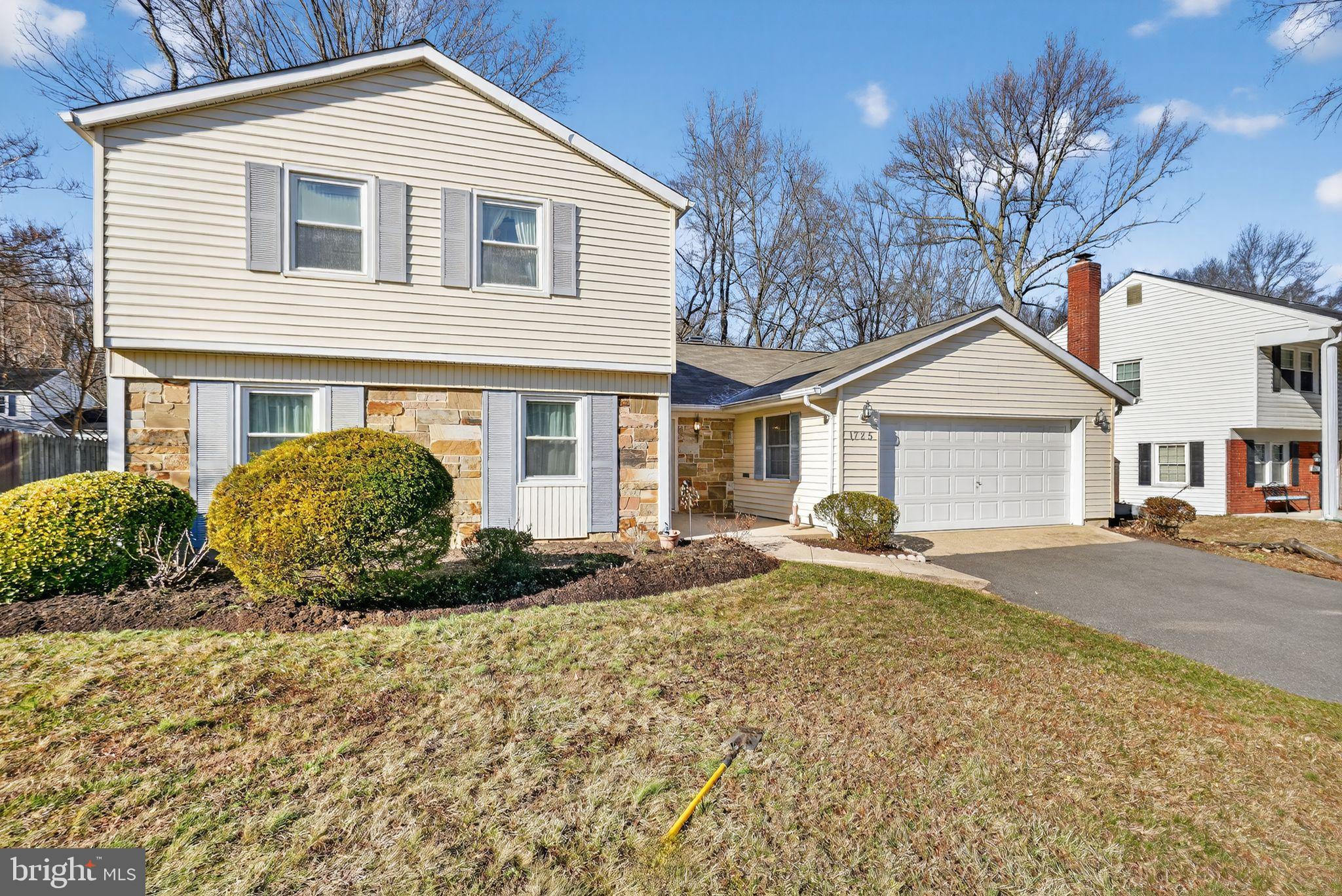 1725 Tarrytown Avenue Crofton, MD 21114 - Photo 3 of 39 a front view of a house with a garden