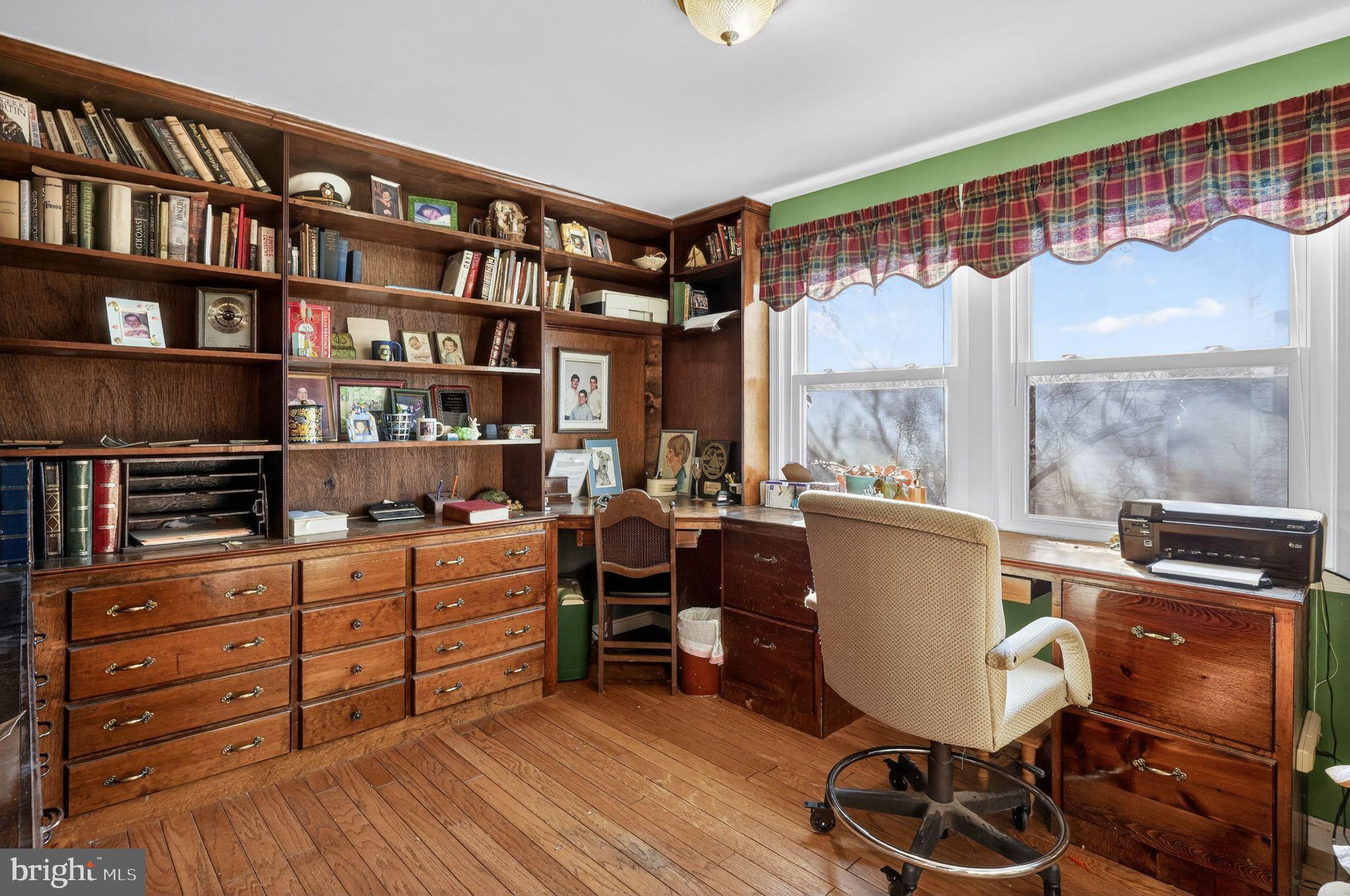 1725 Tarrytown Avenue Crofton, MD 21114 - Photo 31 of 39 a view of a workspace with furniture and a window