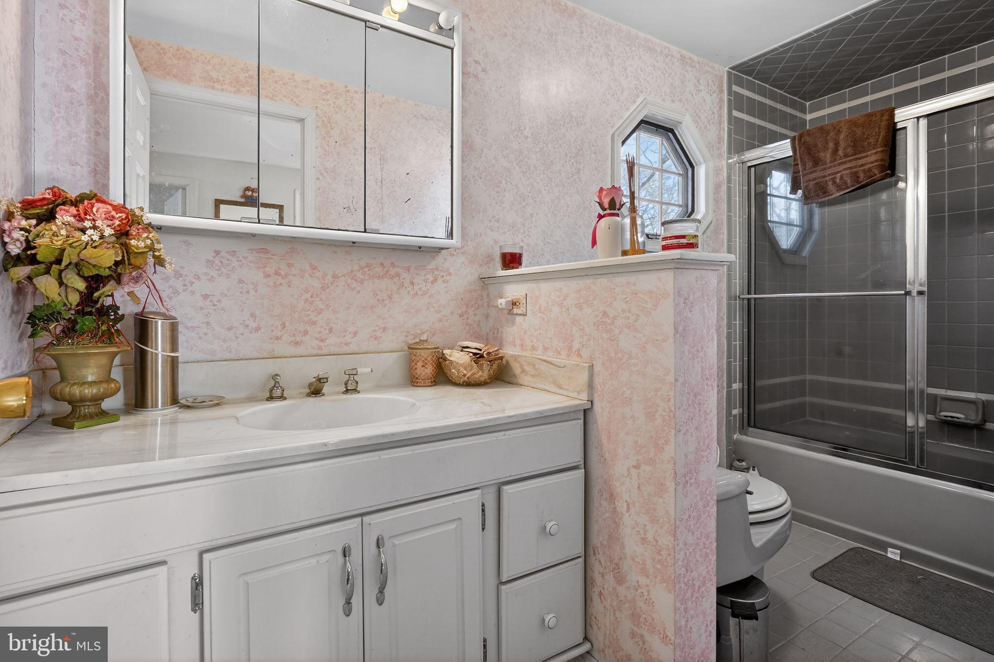 1725 Tarrytown Avenue Crofton, MD 21114 - Photo 32 of 39 a bathroom with a sink a toilet and shower