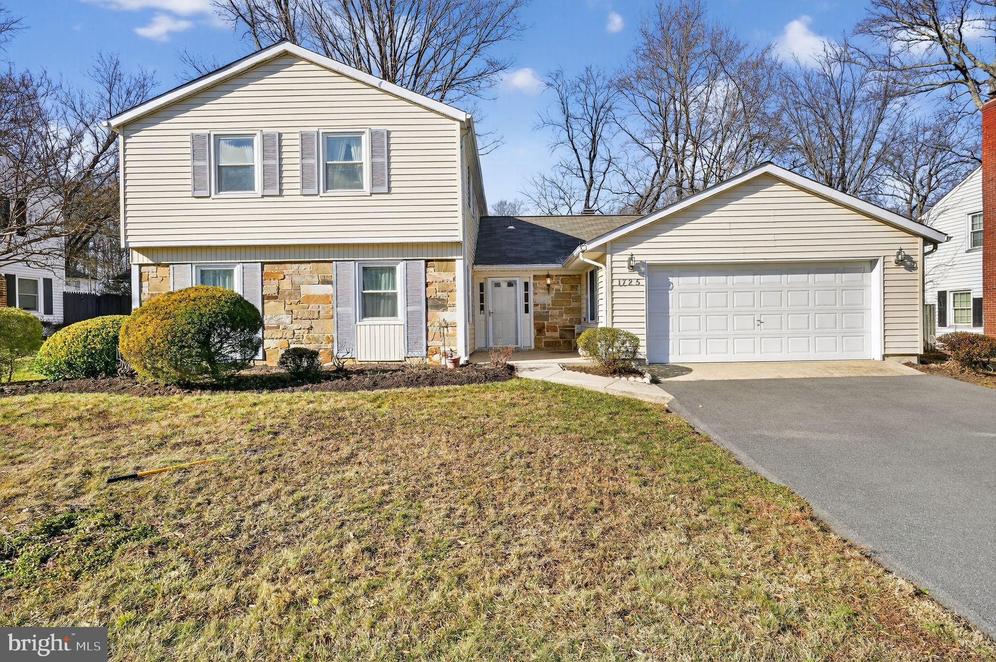1725 Tarrytown Avenue Crofton, MD 21114 - Photo 4 of 39 a front view of a house with a yard