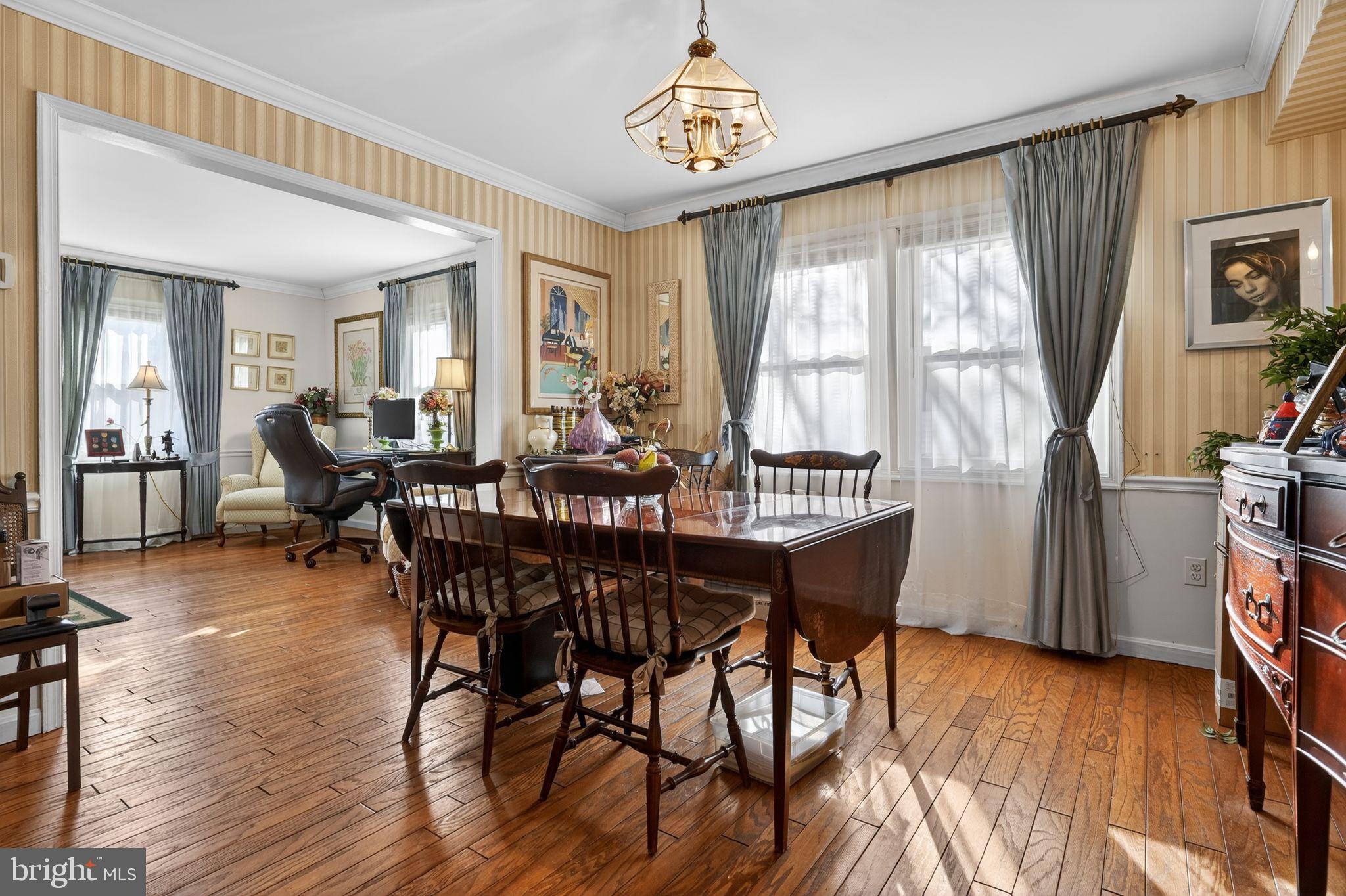 1725 Tarrytown Avenue Crofton, MD 21114 - Photo 10 of 39 a view of a dining room with furniture window and wooden floor
