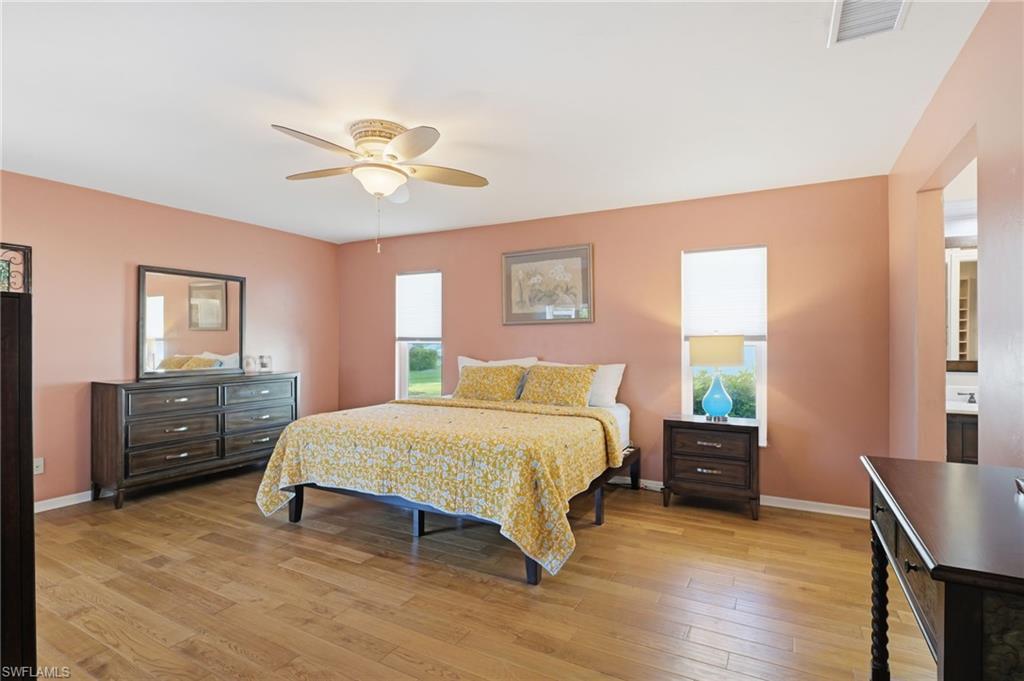 5060 Coldstream Lane Naples, FL 34104 - Photo 20 of 34 King-sized bed