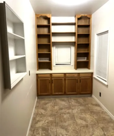 a bathroom with a double vanity sink and a bathtub