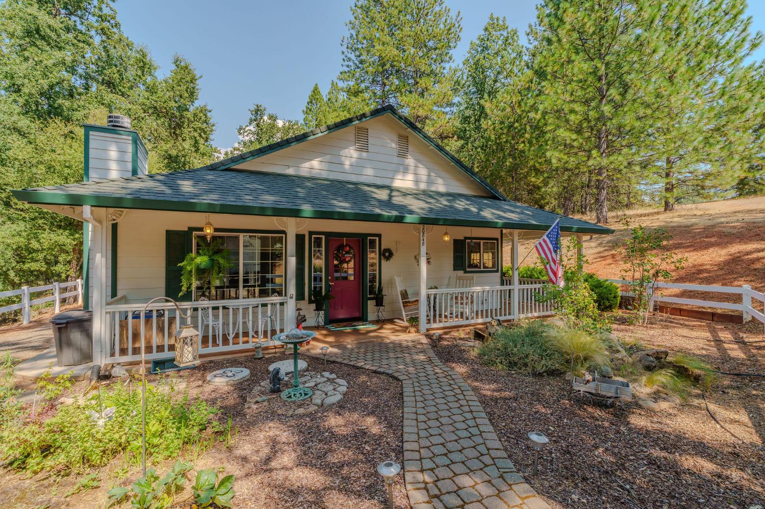 a front view of a house with garden