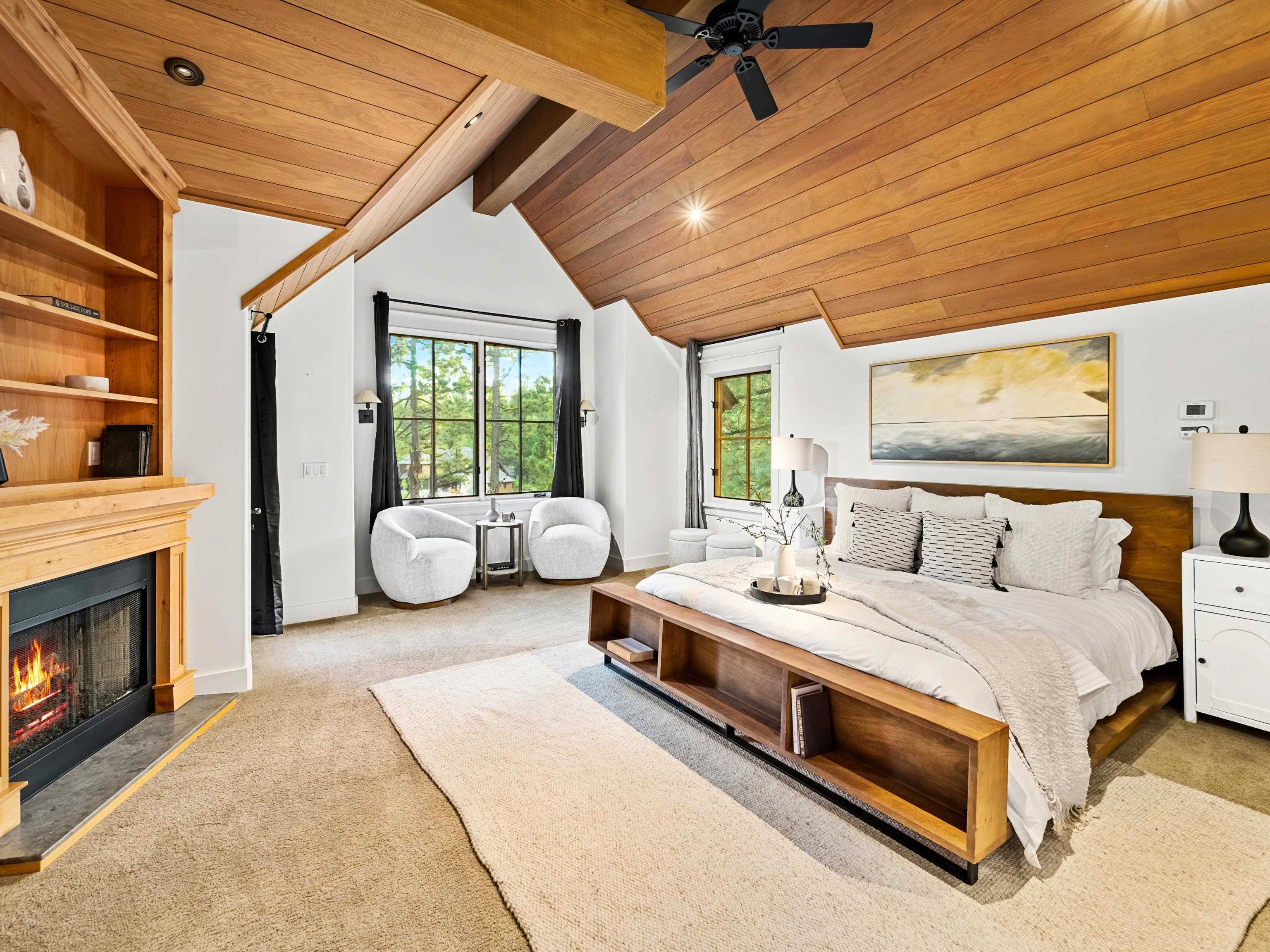 556 Stewart McKay Truckee, CA 96161 - Photo 14 of 27 a bedroom with bed and a fireplace