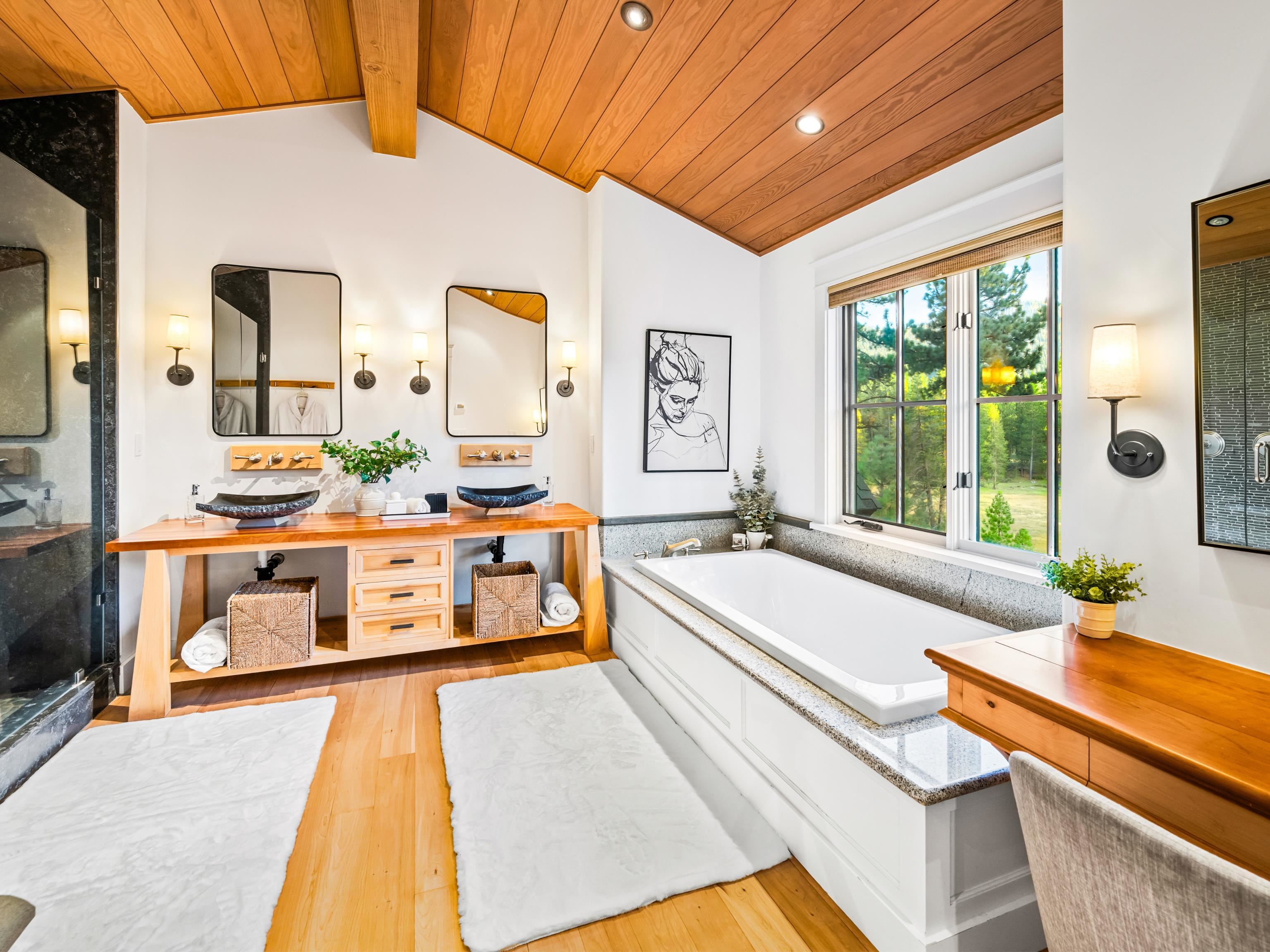 556 Stewart McKay Truckee, CA 96161 - Photo 15 of 27 a spacious bathroom with a large tub and sink