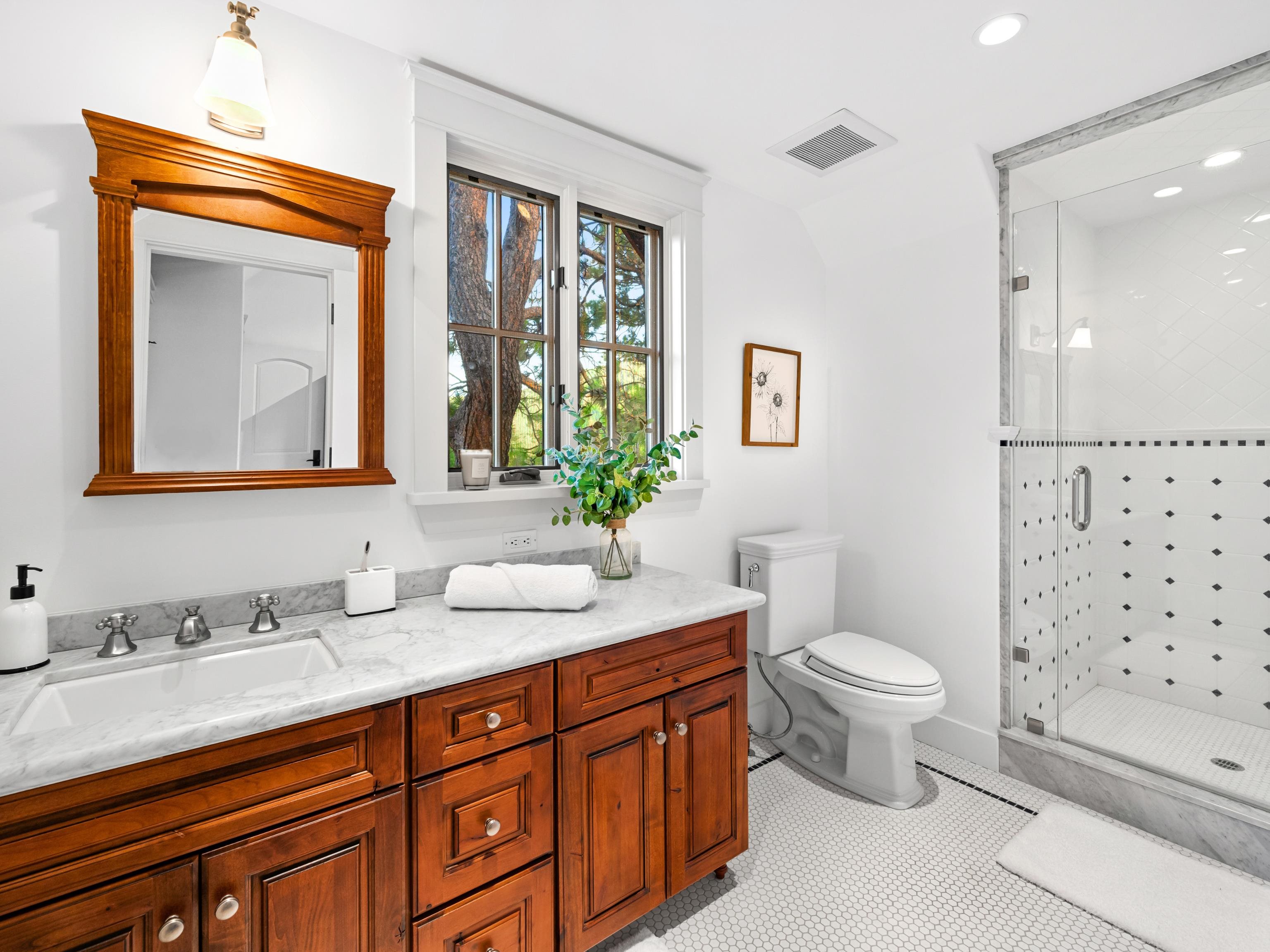 556 Stewart McKay Truckee, CA 96161 - Photo 19 of 27 a bathroom with a sink a toilet and a mirror