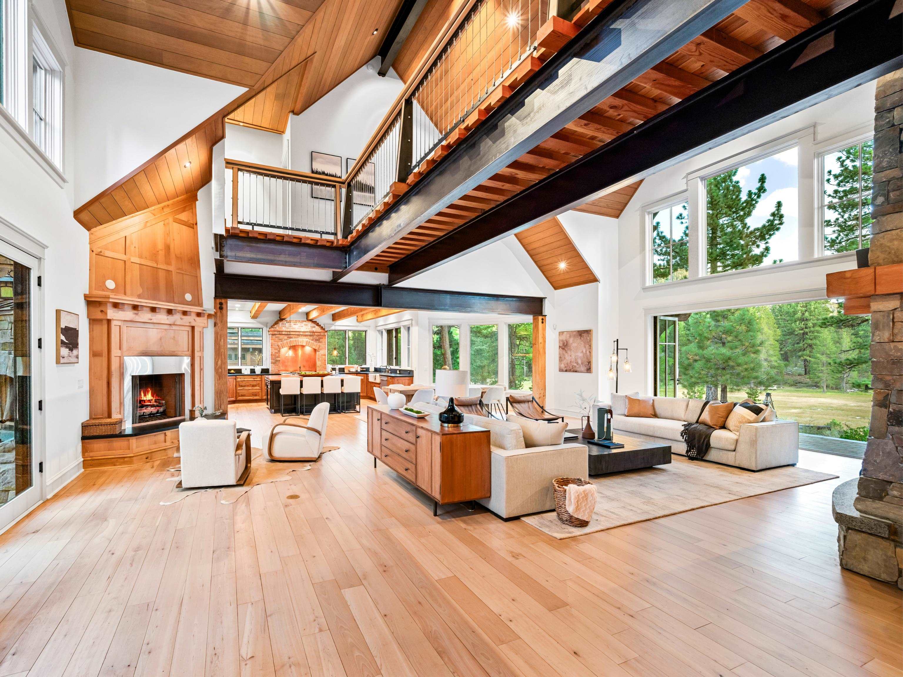 556 Stewart McKay Truckee, CA 96161 - Photo 7 of 27 a living room with furniture floor to ceiling windows and wooden floor