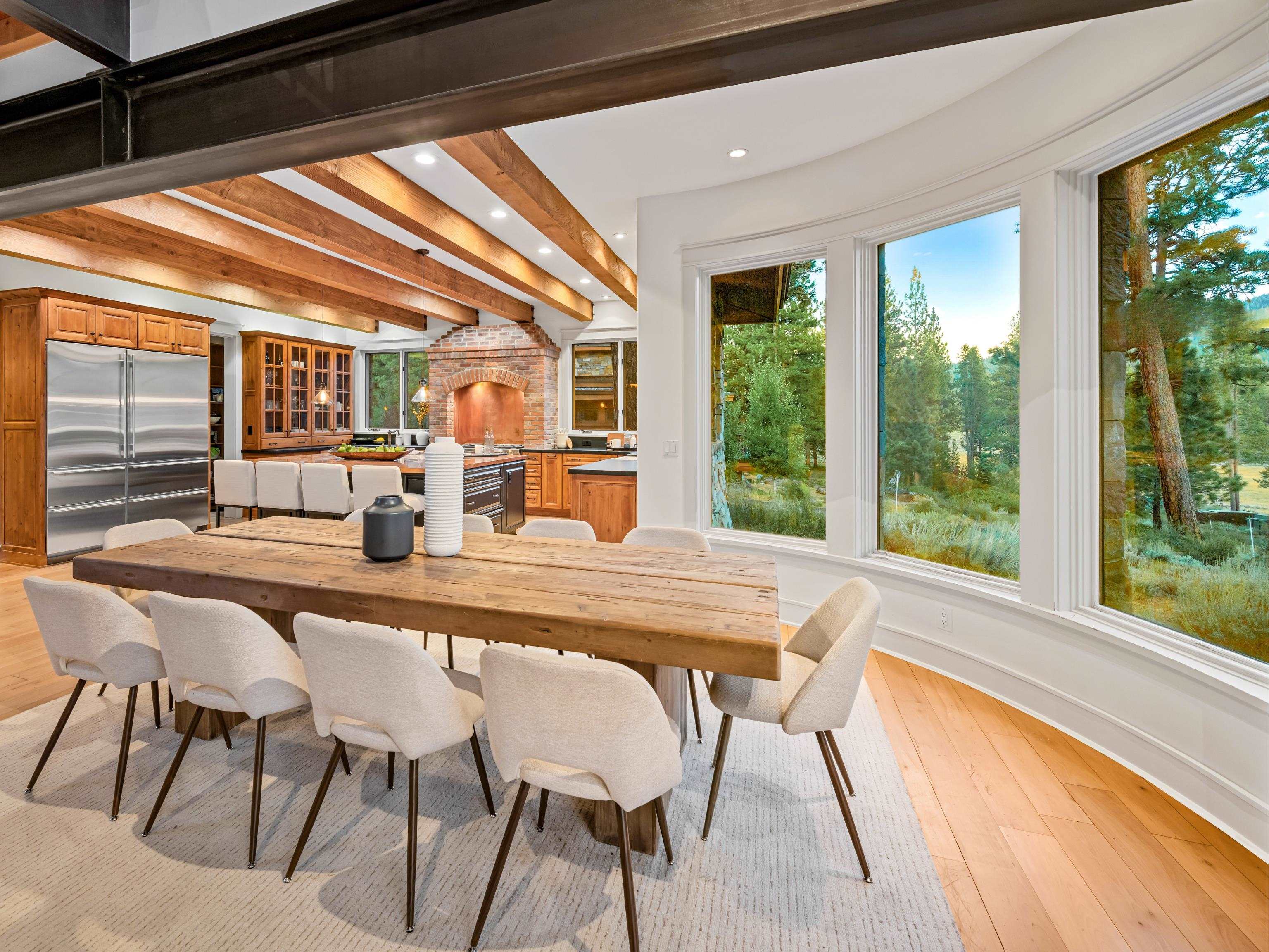 556 Stewart McKay Truckee, CA 96161 - Photo 9 of 27 a view of a dining room with furniture large windows and wooden floor