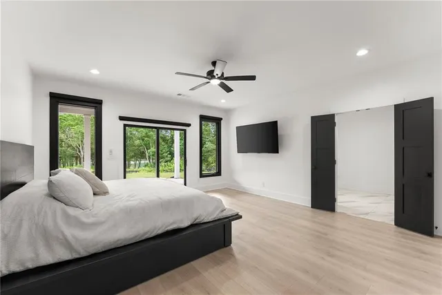 a bathroom with a sink a mirror and a shower