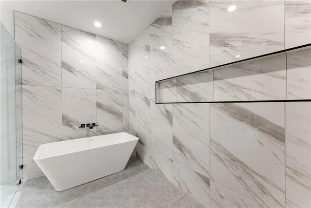 a large kitchen with a table and chairs