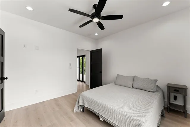 a view of a house with wooden fence