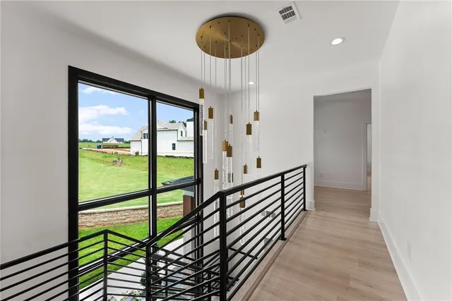 an aerial view of a houses with ocean view