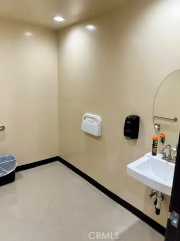 a close view of a sink and a vanity in the kitchen