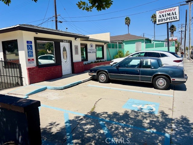 21617 South Figueroa Street Carson, CA 90745 - Photo 3 of 14 a front view of a house with parking space