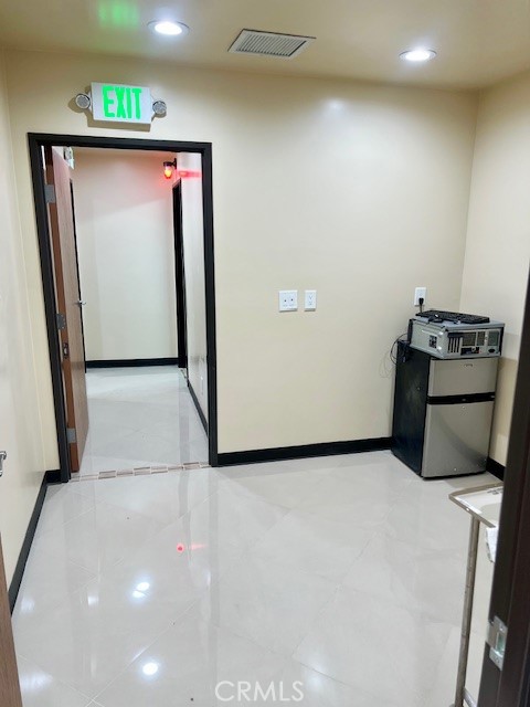 21617 South Figueroa Street Carson, CA 90745 - Photo 9 of 14 a view of a hallway with storage
