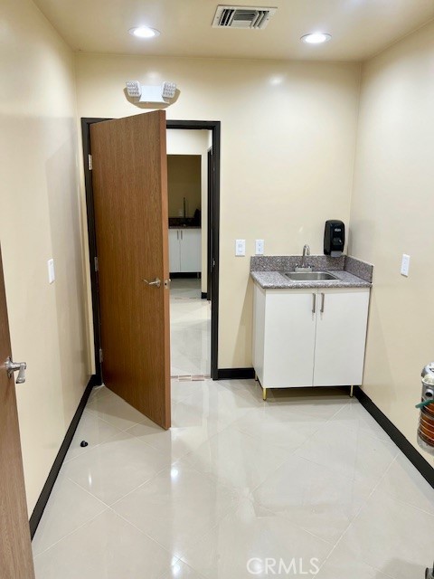 21617 South Figueroa Street Carson, CA 90745 - Photo 10 of 14 a kitchen with stainless steel appliances a refrigerator and a sink
