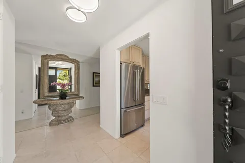 a kitchen with refrigerator a sink and dishwasher
