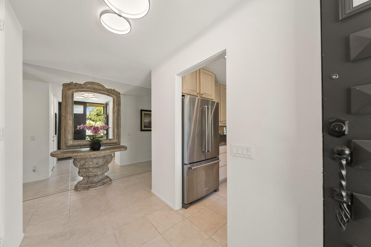 76895 Lark Drive Indian Wells, CA 92210 - Photo 6 of 25 a kitchen with refrigerator a sink and dishwasher