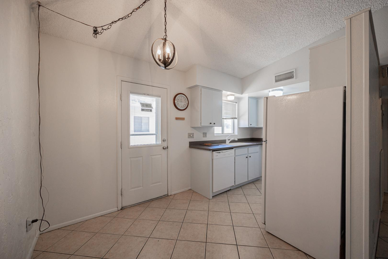 609 South Power Road, Unit 338 Mesa, AZ 85206 - Photo 8 of 24 a kitchen with a refrigerator and a stove top oven