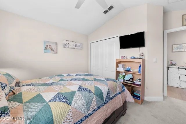 a bedroom with furniture and a lamp