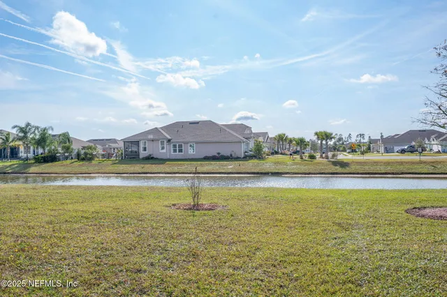a view of a lake with a big yard