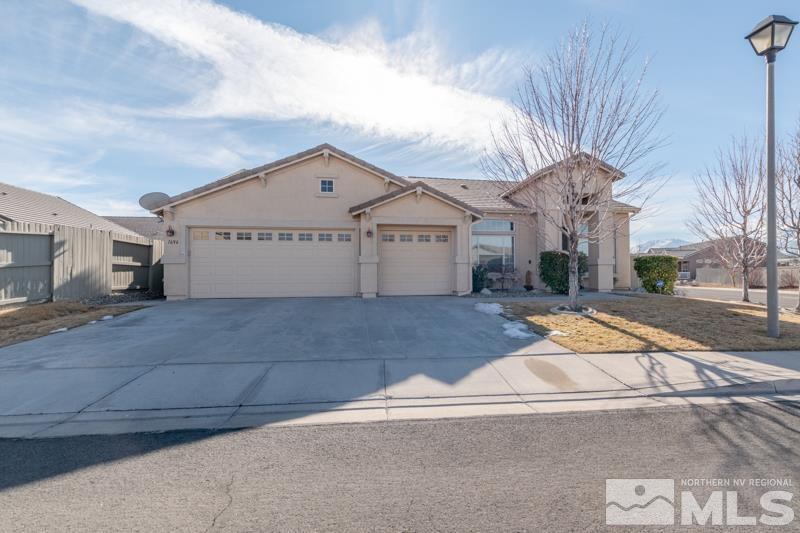 1696 Ghettis Way Reno, NV 89521 - Photo 1 of 25 a view of a white house with a street