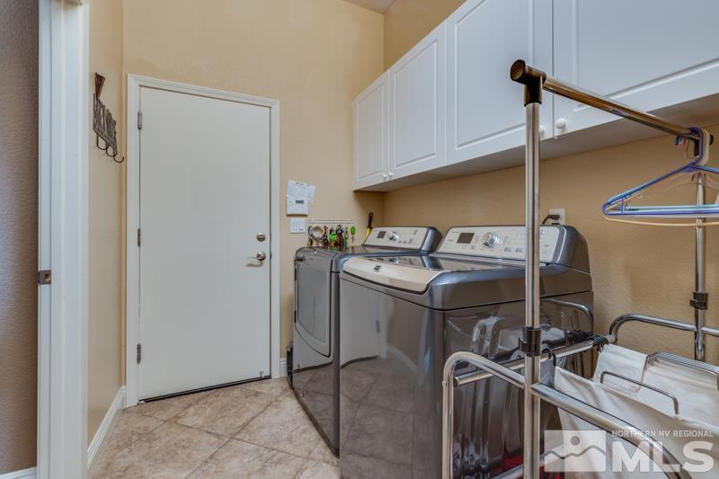 1696 Ghettis Way Reno, NV 89521 - Photo 14 of 25 a utility room with dryer and washer