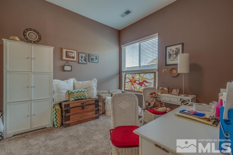 1696 Ghettis Way Reno, NV 89521 - Photo 19 of 25 a living room with furniture and a window