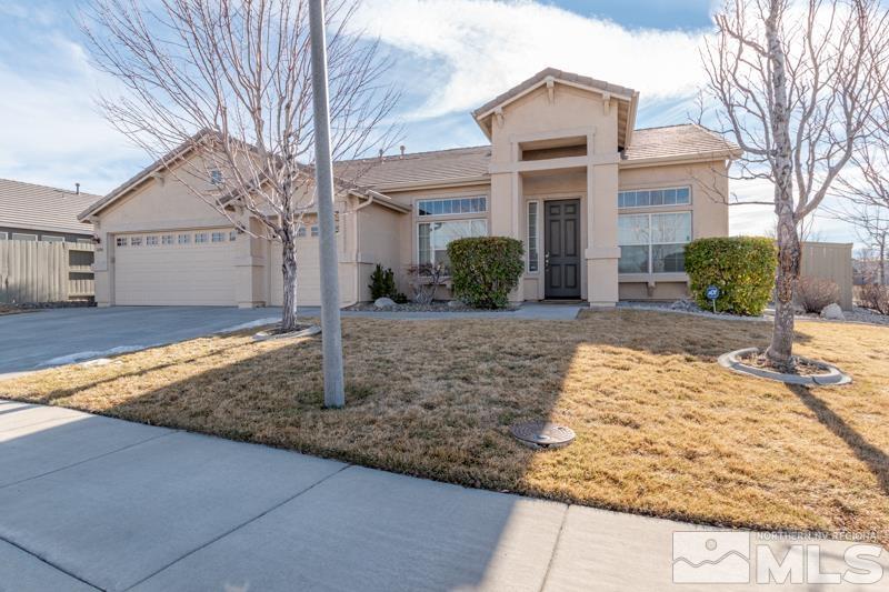 1696 Ghettis Way Reno, NV 89521 - Photo 2 of 25 a front view of a house with garden