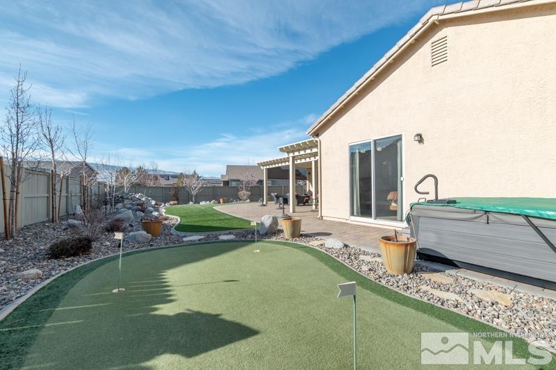 1696 Ghettis Way Reno, NV 89521 - Photo 24 of 25 a swimming pool with outdoor seating and yard